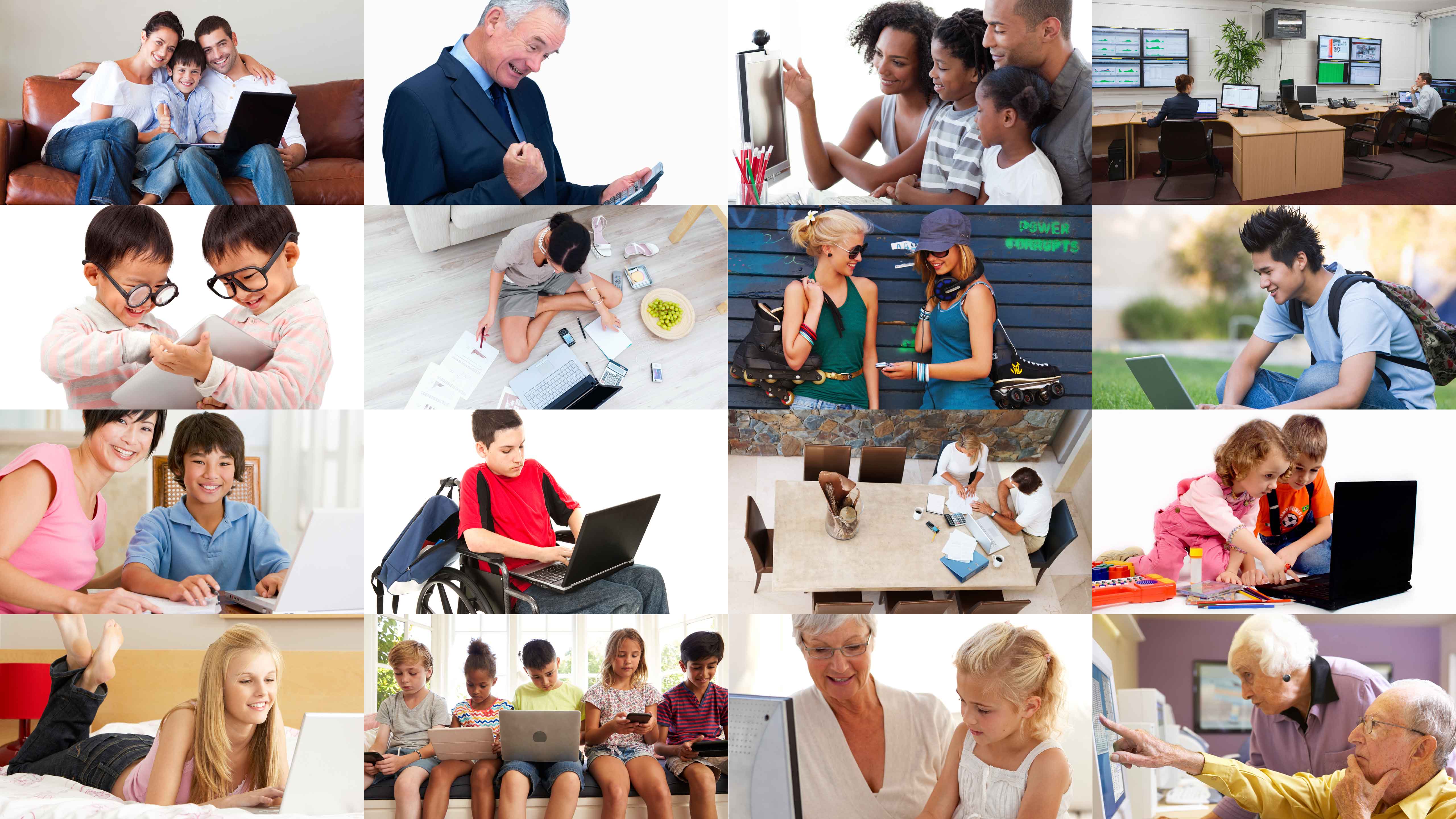 People of different ages and backgrounds using computers together